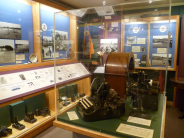 Display of artifacts, timeline, and photographs for Ravnos exhibition.
