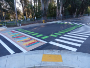 crosswalk with white lines at Clares Street and Wharf Road