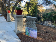 Concrete columns with red pots